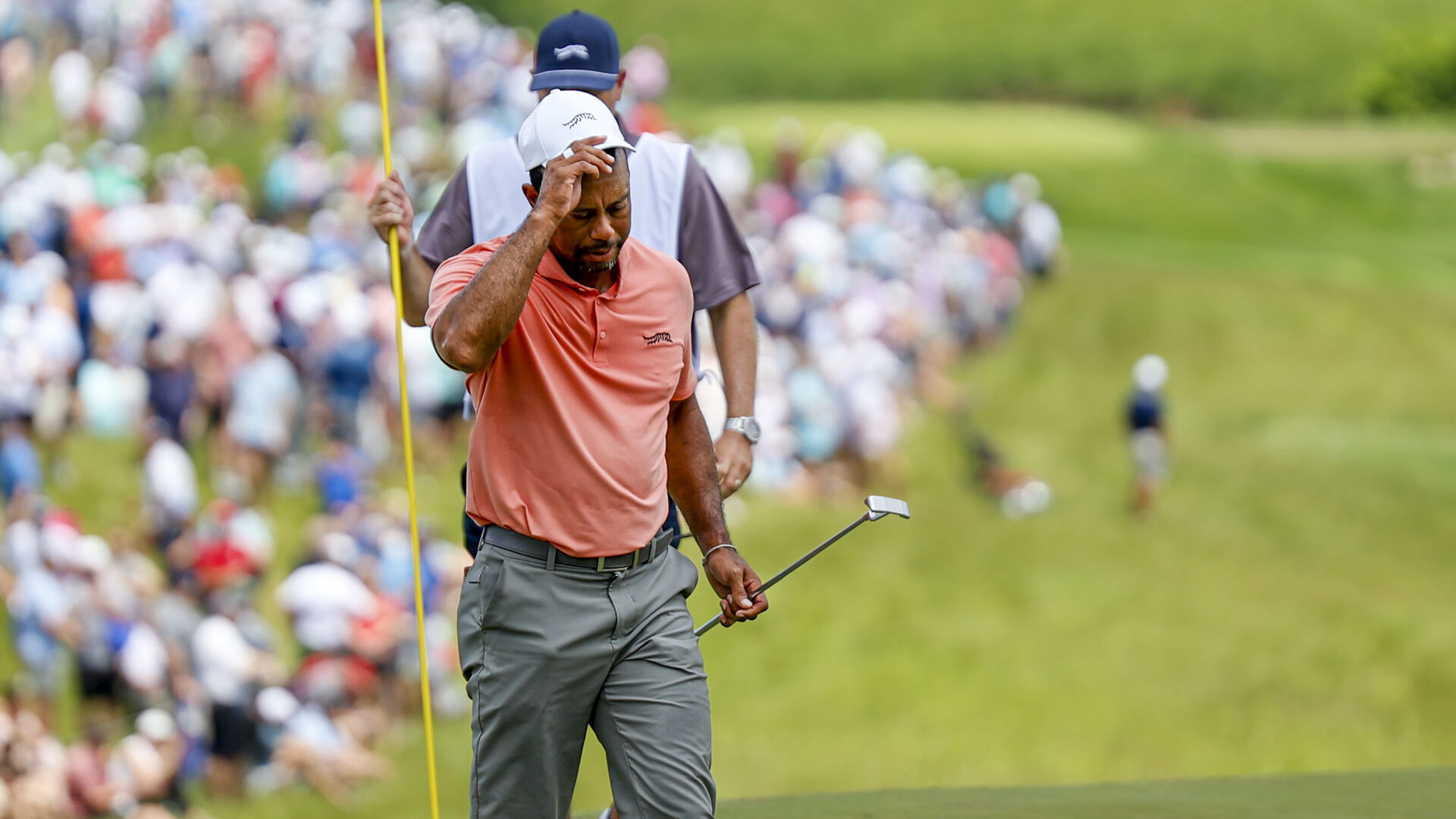 Tiger Woods limps in with 1st-round 72 at the PGA Championship, setting up fight with the cut line Friday